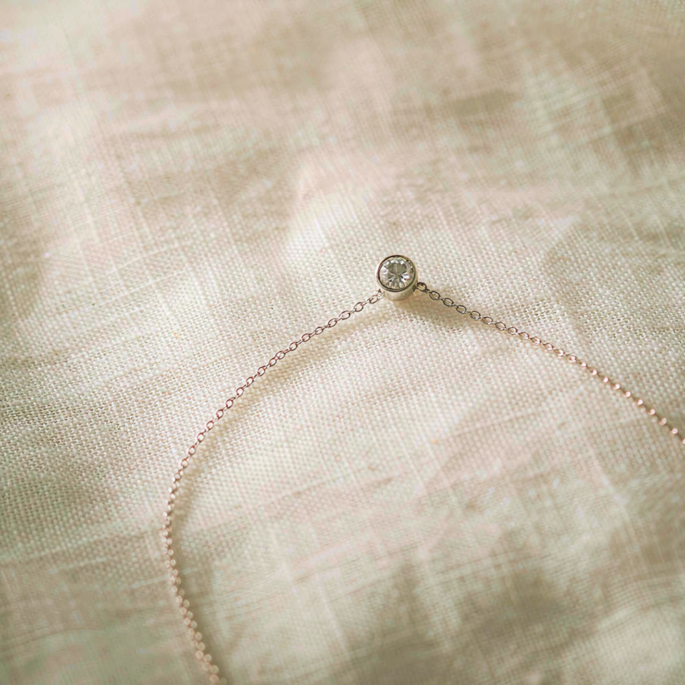 Paw Circle Pendant — Illustration of a lab-grown diamond pet memorial piece